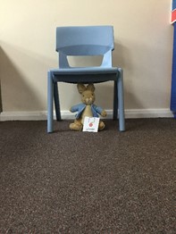 Teddy under the chair